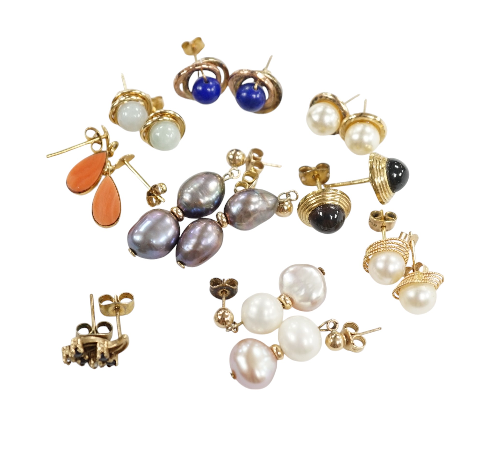 Seven assorted modern pairs of 9ct and gem set earrings and two similar yellow metal pairs. Condition - fair